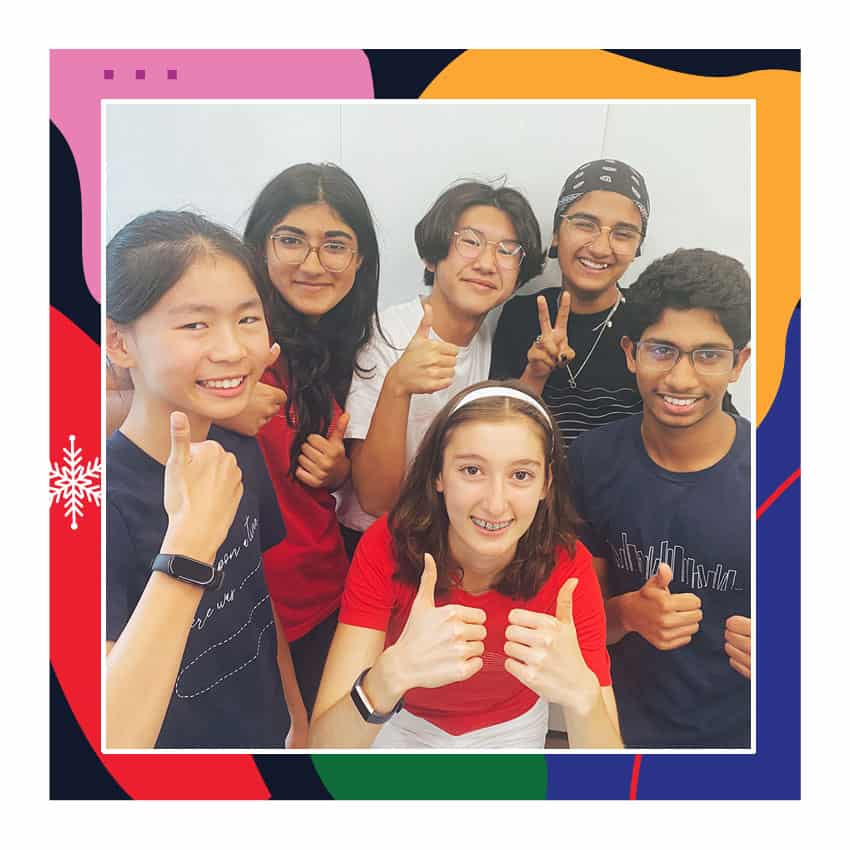 Supportive multicultural youth group smiling, celebrating together at Ripple Foundation, promoting inclusive community programs for children's development and mental health awareness.